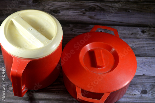 vintage plastic insulated pitchers and food containers, The food containers are often insulated vacuum jars, commonly sought-after items for vintage kitchen decor or collectors of 70s memorabilia