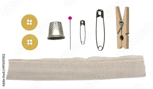 Sewing tools set with buttons, thimble, pins, safety pins, wooden clothespin and fabric strip with seam, isolated