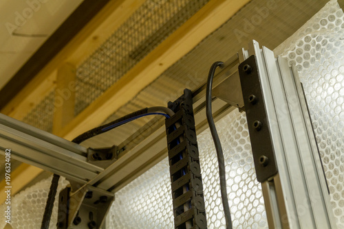 This item is a vertical cable management tray used to organize and protect cables in server racks or machinery. Technology