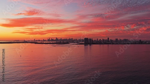 City skyline view. Sunrise cityscape, Florida. Sunset dramatic sky Miami city. Seascape with cityscape on sunset. Night cityscape of Miami with sea and dramatic sky. Miami sunset aerial sea