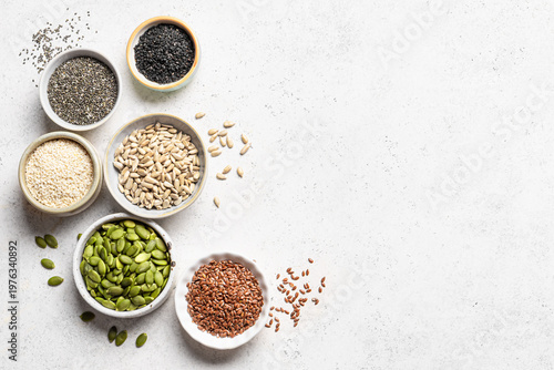 Fotografia Assortment of seeds in bowls for healthy eating
