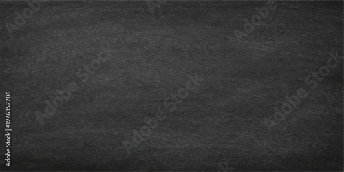 A dark textured surface with a black leather background and rough chalkboard material creates a blank grunge textile pattern for use as a natural old fabric wallpaper