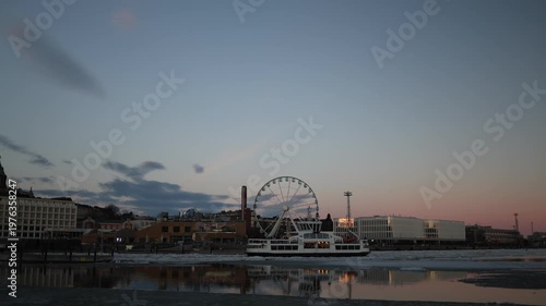 Ferry ship approaching icy shore in Helsinki winter sea frozen water slow movement cold nordic atmosphere harbor transport scene