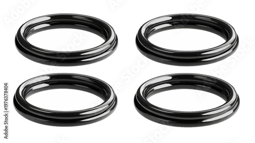 Four glossy black rings arranged in a square shape, each with a smooth, reflective surface