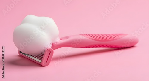 Pink Shaving Razor with White Foam on a Vibrant Pink Background for Personal Care and Beauty