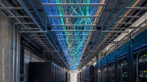 Slika na platnu A long corridor in a data center with rows of server racks and colorful wires on