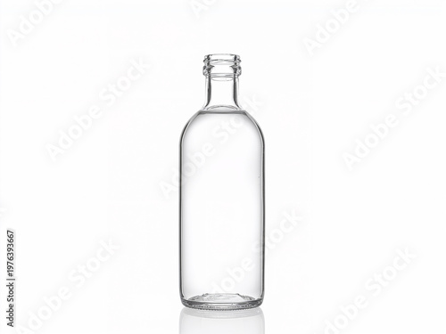 Empty clear glass bottle with reflection on white background