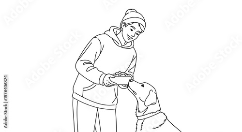 A kind young person wearing a winter hat and hoodie is lovingly feeding a happy dog from a bowl, sharing a heartwarming moment.