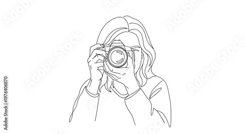 A focused young woman holding a professional camera to her eye, capturing a moment with intense concentration and artistic intent.