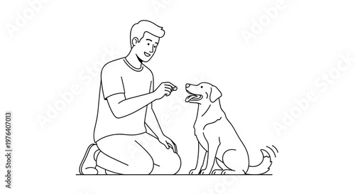 A kind young man is kneeling and offering a treat to a well-behaved dog, engaging in positive training or bonding.