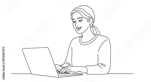A happy young woman is comfortably working or studying on her laptop computer, smiling pleasantly while looking at the screen.