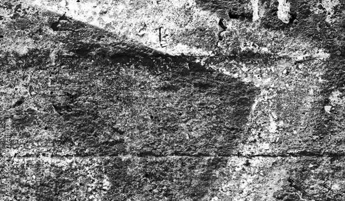 Cracked surface showcasing a mix of gray painted textures, offering a rustic aesthetic ideal for backgrounds or creative art projects. The rough texture highlights natural and artistic details