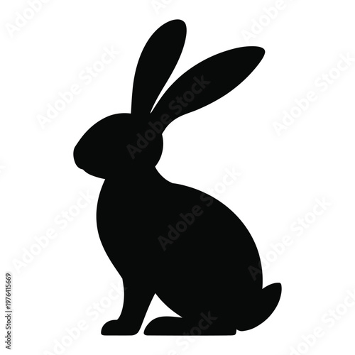 A striking black silhouette of a rabbit sitting alertly showcasing its long ears silhouette
