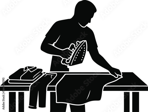 Man ironing clothes on a table with an iron and folded garments in a domestic setting Keywords: ironing