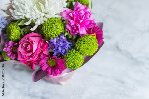 Absolutely gorgeous, multicoloured bouquet in a flower box on marble background.soft pastel floral composition for mother day celebration greeting and holiday. copy space