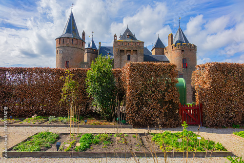 The medieval Castle Muiden (Muiderslot). Muiderslot was commissioned by Count Floris and completed in 1285. View of Muiden Castle from its gardens. Muiden, The Netherlands.