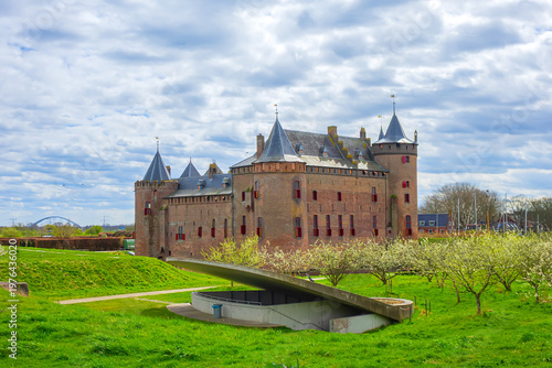 The medieval Castle Muiden (Muiderslot). Muiderslot was commissioned by Count Floris and completed in 1285. View of Muiden Castle from its gardens. Muiden, The Netherlands.