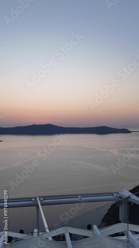 Panoramic view of the caldera, the volcano of Santorini Greece and a beautiful colourful sunset