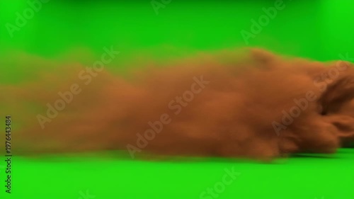A dynamic close-up shot of brown dust clouds swirling against a vibrant green screen background, perfect for visual effects and motion graphics