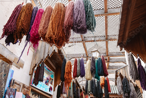 Tableau sur toile Dyed wool hanging to dry in artisan dye workshops in the medina of Fez