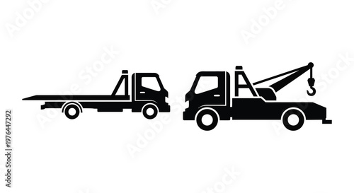 Two tow trucks in black displaying a distinct vehicular silhouette