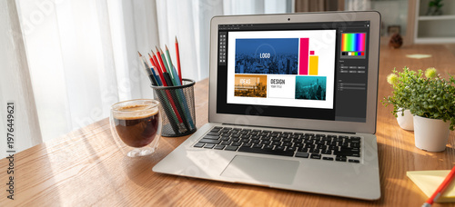 Graphic designer software for modern design of web page and commercial ads showing on the computer screen
