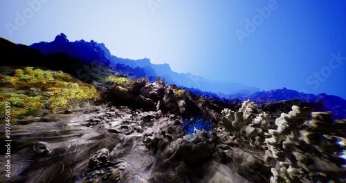In a stunning coastal area, rugged rock formations rise steeply, adorned with vibrant greenery. The sky is a brilliant blue, creating a vivid contrast with the rocky landscape.