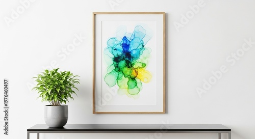 A minimalist vertical wooden picture frame hangs on a plain white wall above a sleek modern console table with a small green potted plant, mockup, simple, living