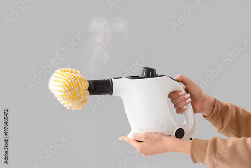 Female hands with steam cle...