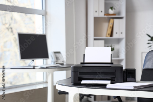Obraz na płótnie Modern printer with paper sheets on desk in office