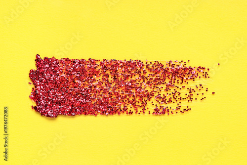 Red glitter stroke on yello...