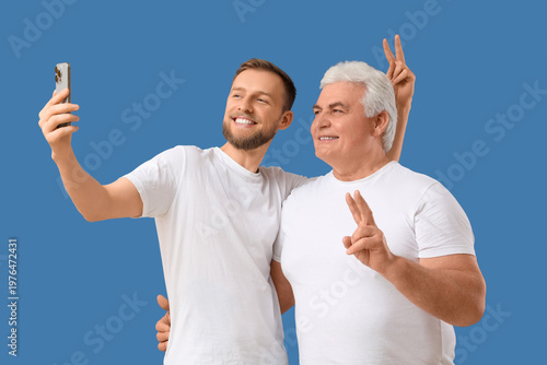 Senior man and his son taki...