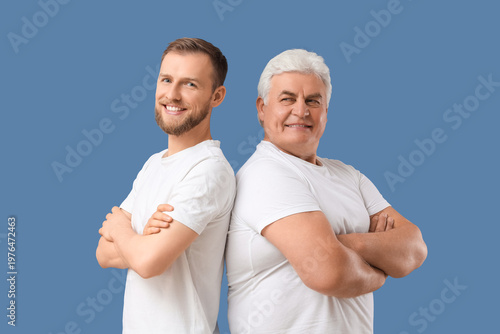 Senior man and his son stan...