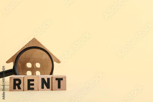 Word RENT with wooden house...