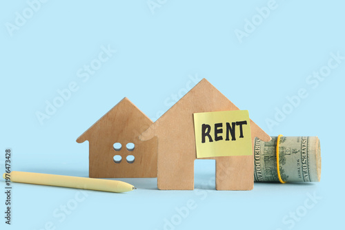 Wooden houses with money an...