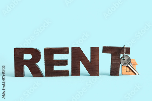 Word RENT with house key on...