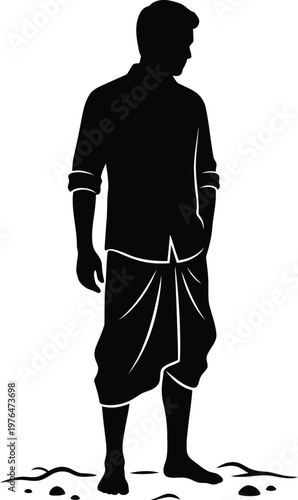 Silhouette of a man wearing a traditional dhoti and shirt standing with hands in pockets male person