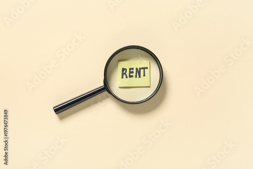 Word RENT under magnifying ...