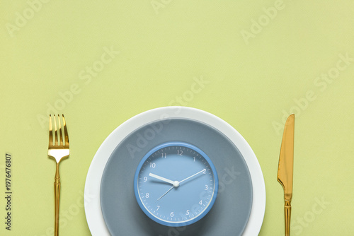 Plate with cutlery and alar...