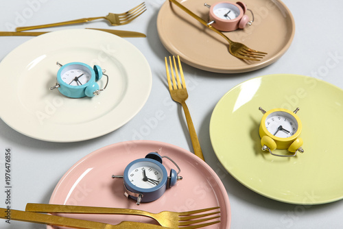 Plates with cutlery and ala...
