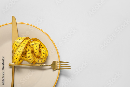 Plate with measuring tape a...