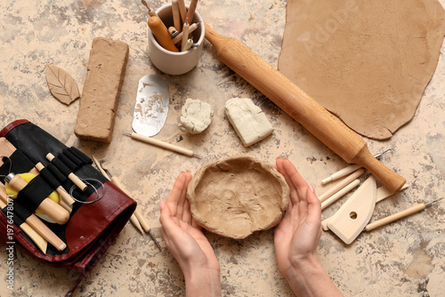 Clay plate and sculptor too...