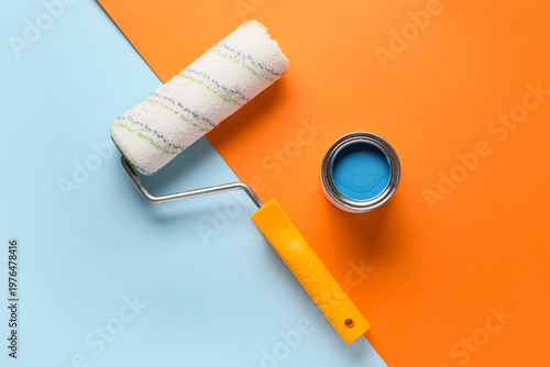 Roller with can of blue pai...
