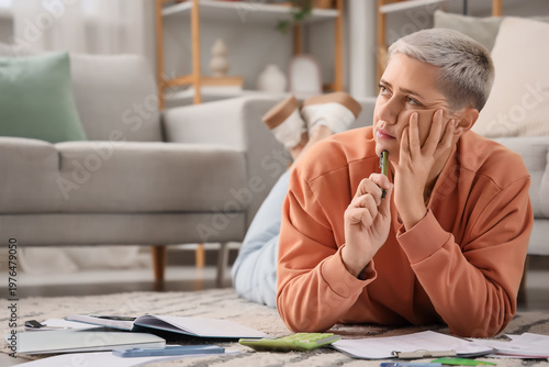 Thoughtful mature woman in ...