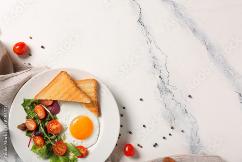 Plate with tasty fried egg,...