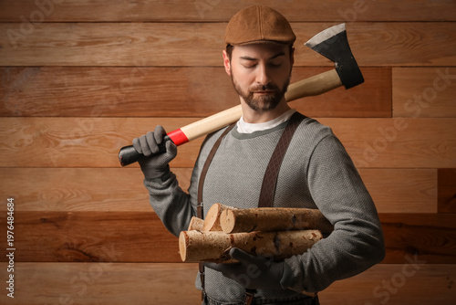 Man with ax and firewood on...