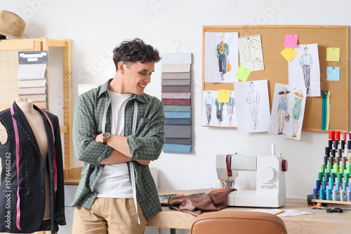 Young male tailor standing ...