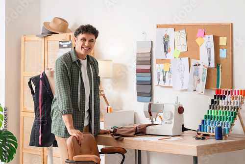 Young male tailor standing ...