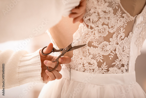Female hands cutting lace o...