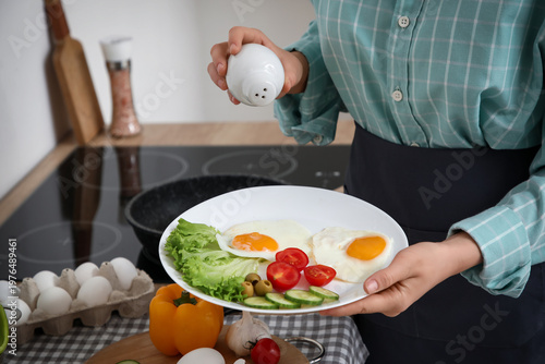 Woman with plate of vegetab...